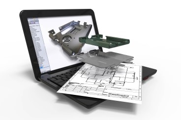 parts and a blueprint over a laptop